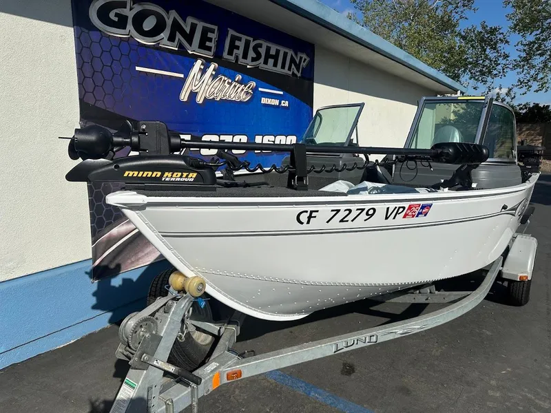 Slide: The Image of 2011 Lund 1625 Rebel XL Sport boat on trailer at dealership. - 5