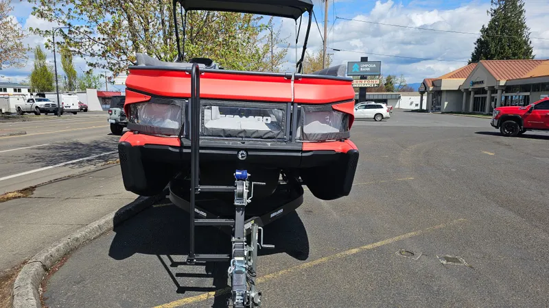 Slide: The Image of 2025 Sea-Doo Switch Cruise 21 on trailer, parked in urban setting. - 4