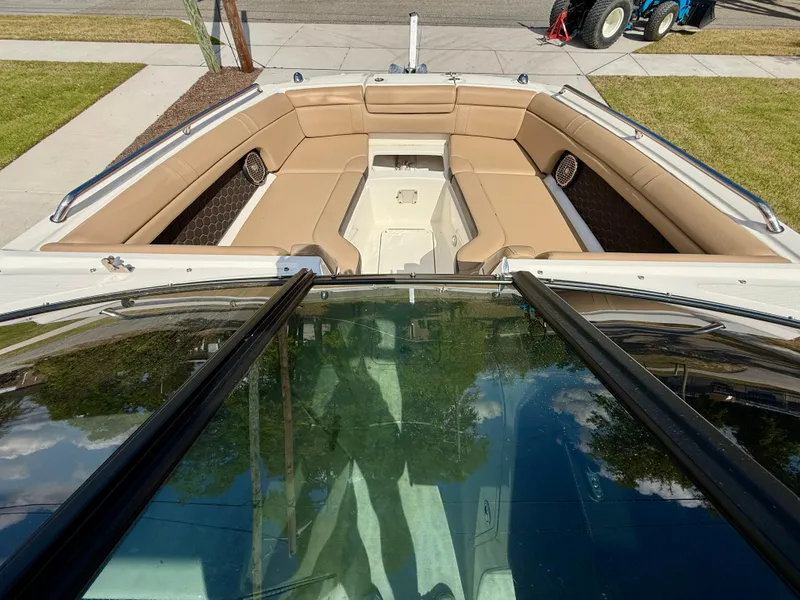Slide: The Image of 2018 Sea Ray SDX 270 boat with spacious tan seating and sleek design. - 14