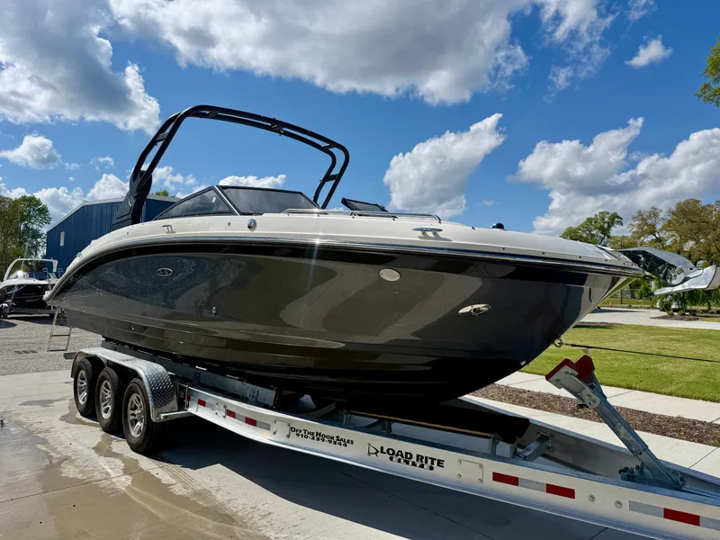 Slide: The Image of 2018 Sea Ray SDX 270 boat on trailer under blue sky with clouds. - 6