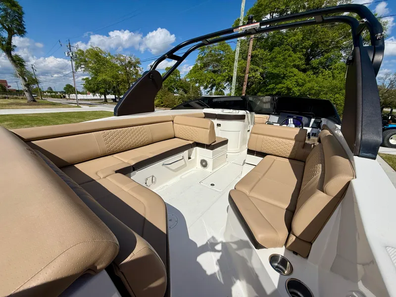 Slide: The Image of 2018 Sea Ray SDX 270 boat interior with beige seating and sleek design. - 8