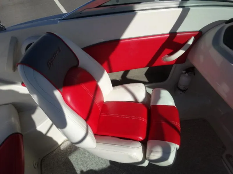 Slide: The Image of 2007 Sea Ray 185 Sport boat interior with red and white seating. - 10
