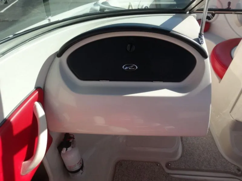 Slide: The Image of 2007 Sea Ray 185 Sport boat interior with red accents and a fire extinguisher. - 11