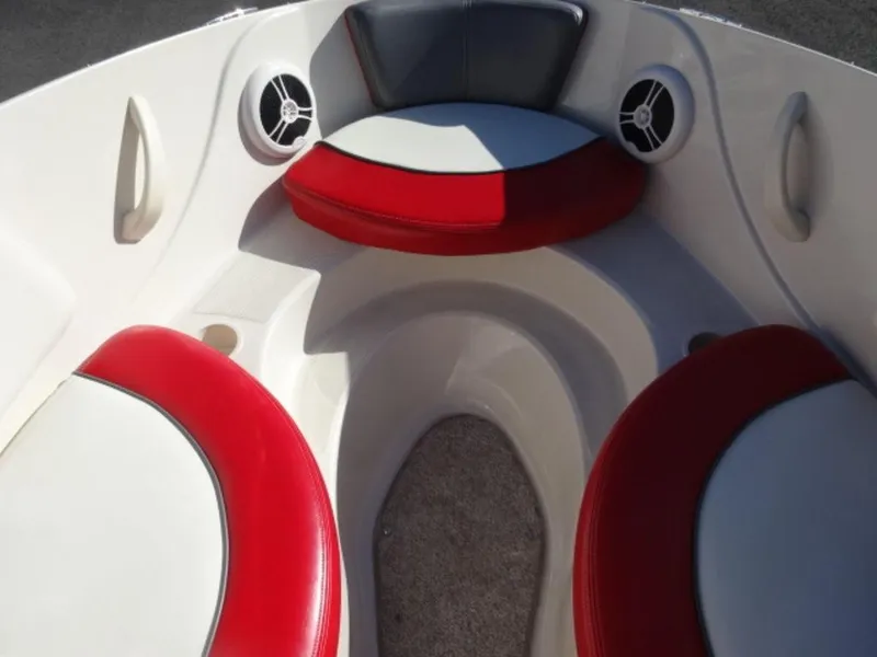 Slide: The Image of 2007 Sea Ray 185 Sport boat interior with red and white seating and speakers. - 14