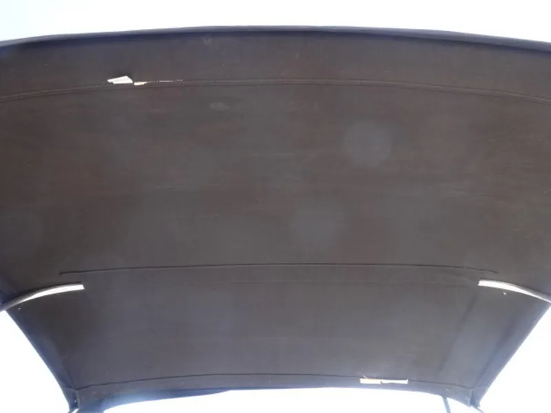 Slide: The Image of Bimini top of 2007 Sea Ray 185 Sport boat, showing wear and tear. - 16