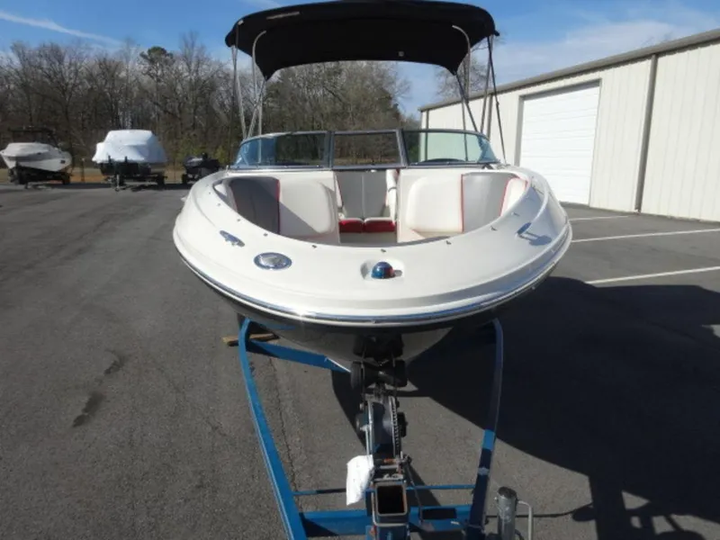 Slide: The Image of 2007 Sea Ray 185 Sport boat on trailer, parked outdoors. - 2