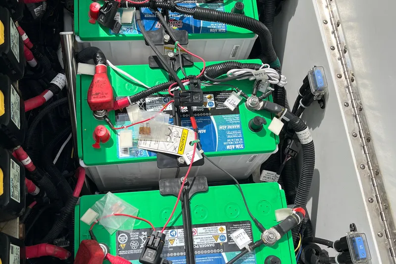 Slide: The Image of Batteries in a 2018 Boston Whaler 380 Outrage boat, showcasing wiring and connections. - 18