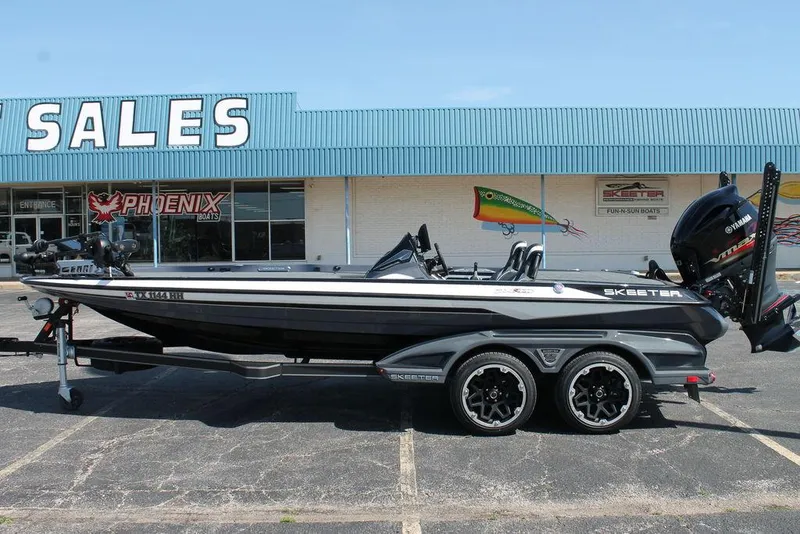 Slide: The Image of 2020 Skeeter FXR21 Apex boat on trailer outside sales building. - 0