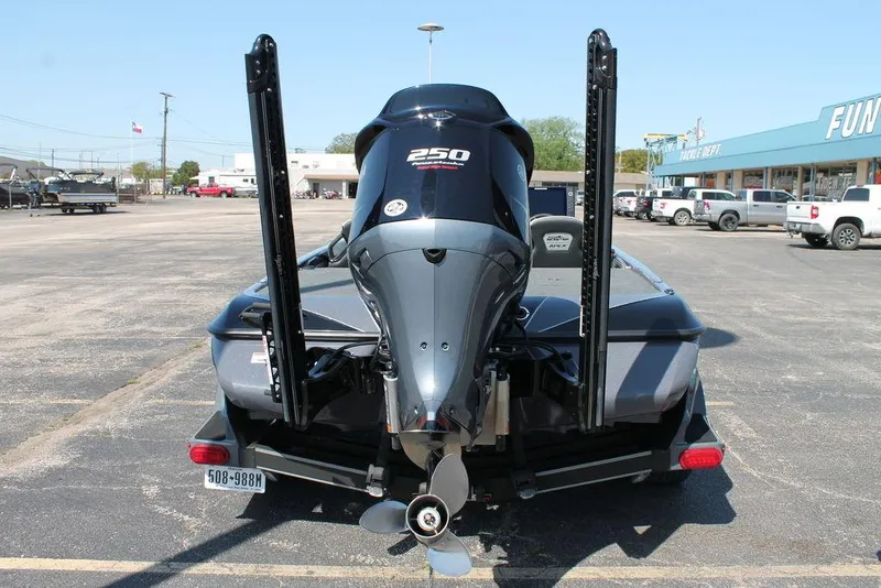 Slide: The Image of 2020 Skeeter FXR21 Apex boat with powerful 250 engine, parked in a lot. - 1