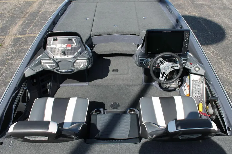 Slide: The Image of 2020 Skeeter FXR21 Apex boat interior with dual seats and advanced dashboard controls. - 10