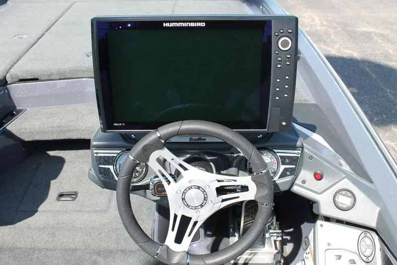 Slide: The Image of 2020 Skeeter FXR21 Apex boat dashboard with steering wheel and Humminbird display. - 11