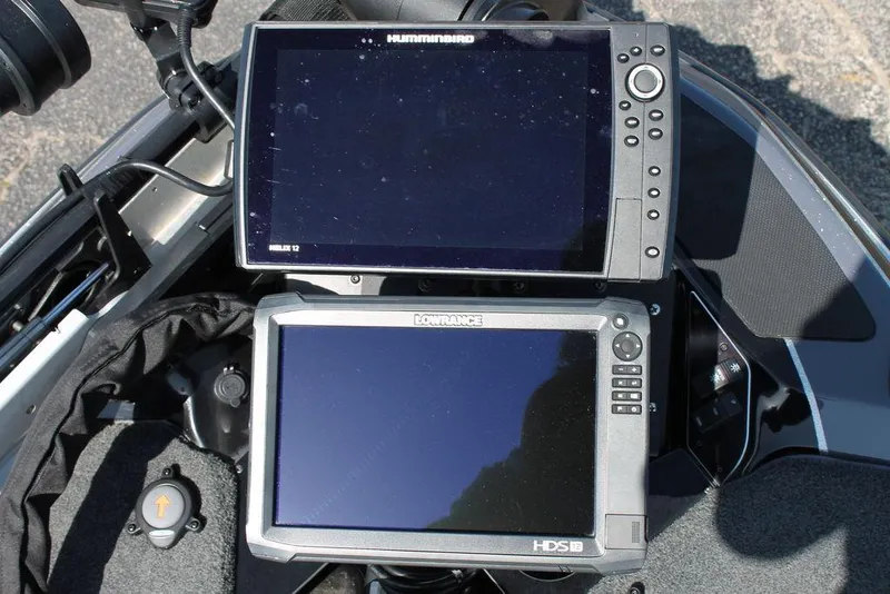 Slide: The Image of Dual fish finders on a 2020 Skeeter FXR21 Apex boat dashboard. - 14