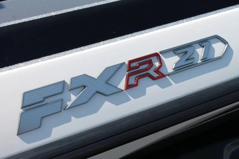 Slide: The Image of 2020 Skeeter FXR21 Apex logo on boat exterior, showcasing sleek design. - 15