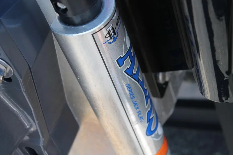 Slide: The Image of Close-up of a 2020 Skeeter FXR21 Apex hydraulic component with branding. - 2