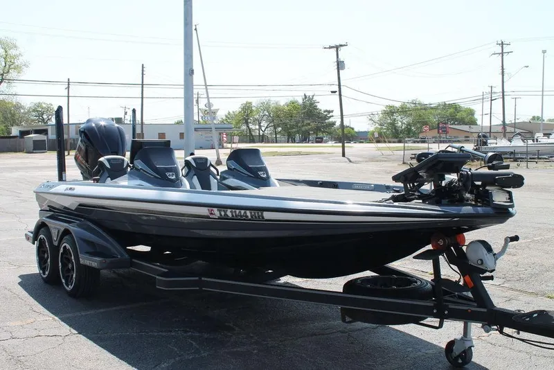 Slide: The Image of 2020 Skeeter FXR21 Apex boat on trailer in parking lot. - 5