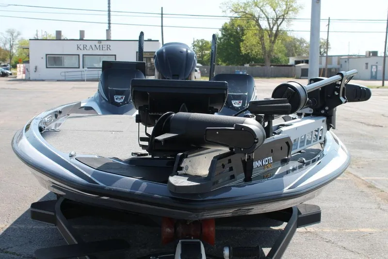 Slide: The Image of 2020 Skeeter FXR21 Apex boat with Minn Kota trolling motor, parked outdoors. - 7