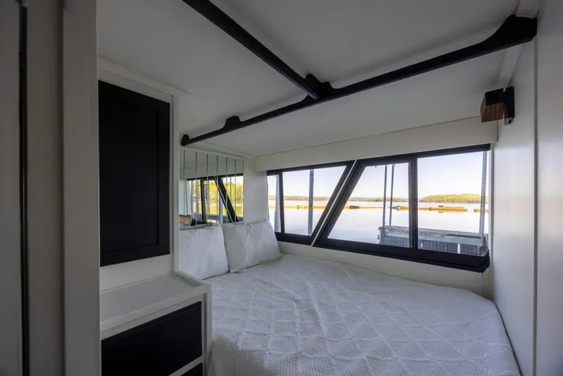 Slide: The Image of Bedroom interior of 1990 Bluewater Yachts 55 Yacht with scenic window view. - 12