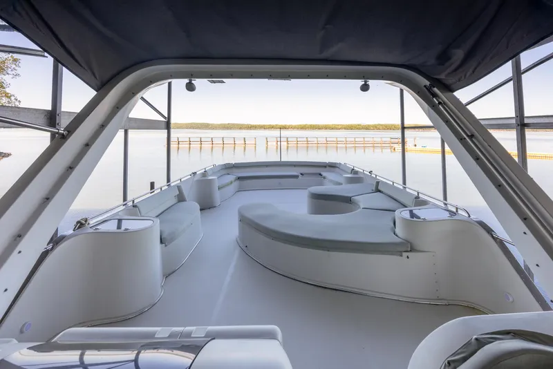 Slide: The Image of 1990 Bluewater Yachts 55 Yacht interior with spacious seating and scenic water view. - 3