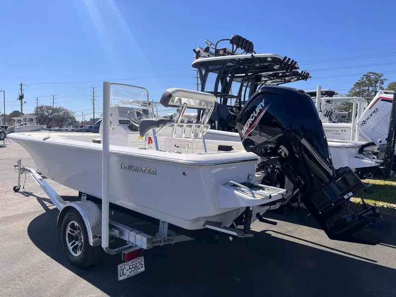 Slide: The Image of 2024 Tidewater 1910 Bay Max boat on trailer with Mercury outboard motor. - 2