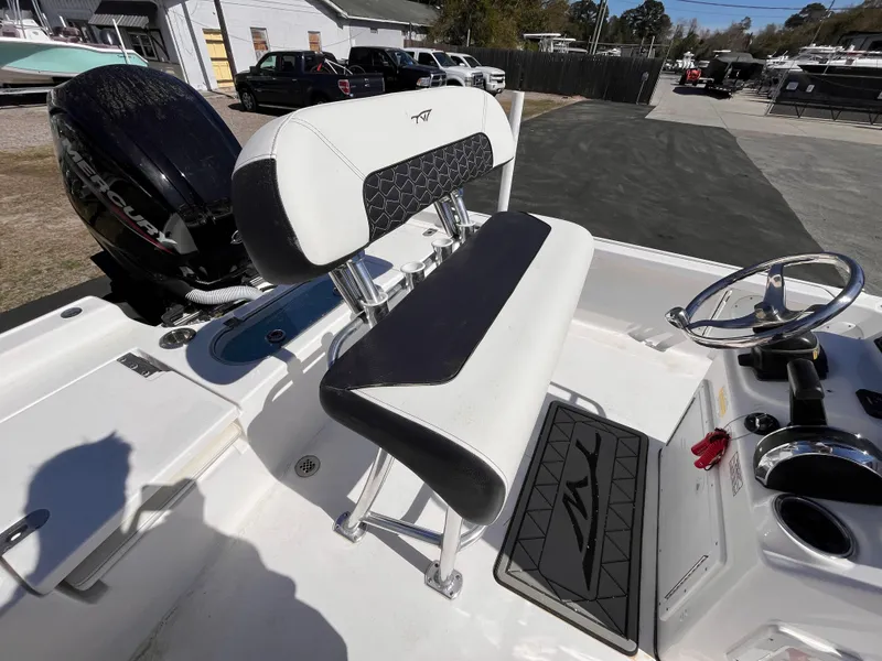 Slide: The Image of 2024 Tidewater 1910 Bay Max boat interior with seating and steering wheel. - 5