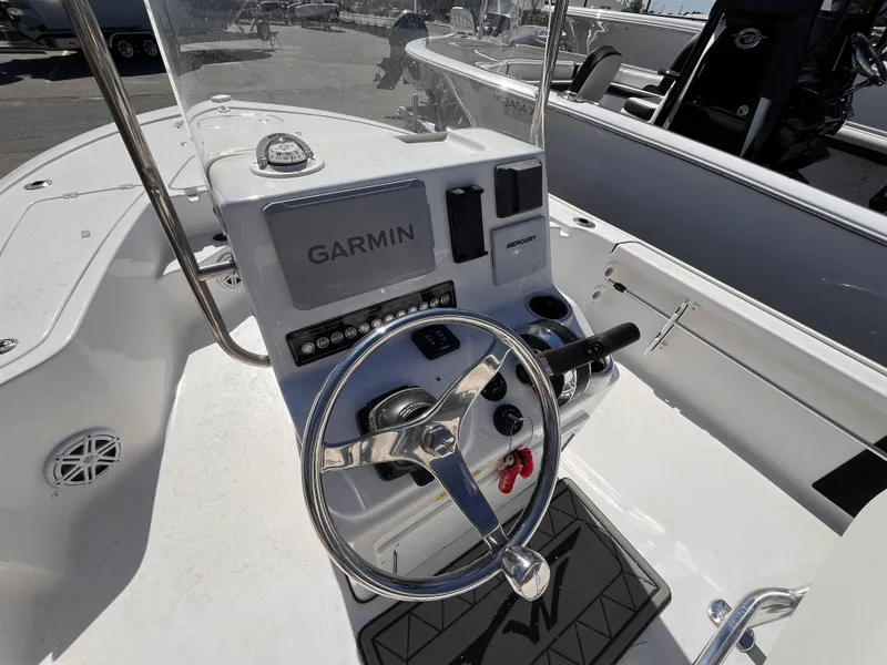 Slide: The Image of 2024 Tidewater 1910 Bay Max boat console with Garmin navigation system and steering wheel. - 7