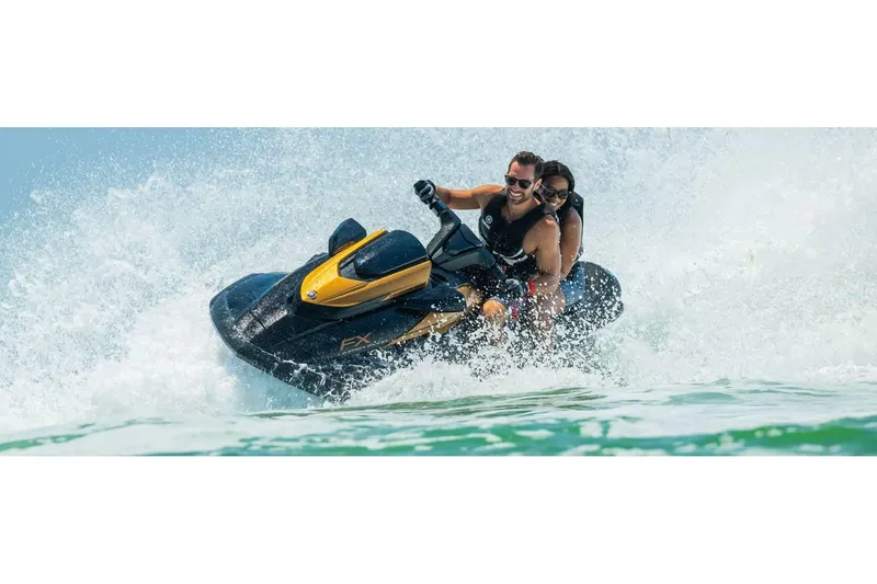 Slide: The Image of 2024 Yamaha FX Limited SVHO jet ski with two riders enjoying a thrilling water ride. - 6