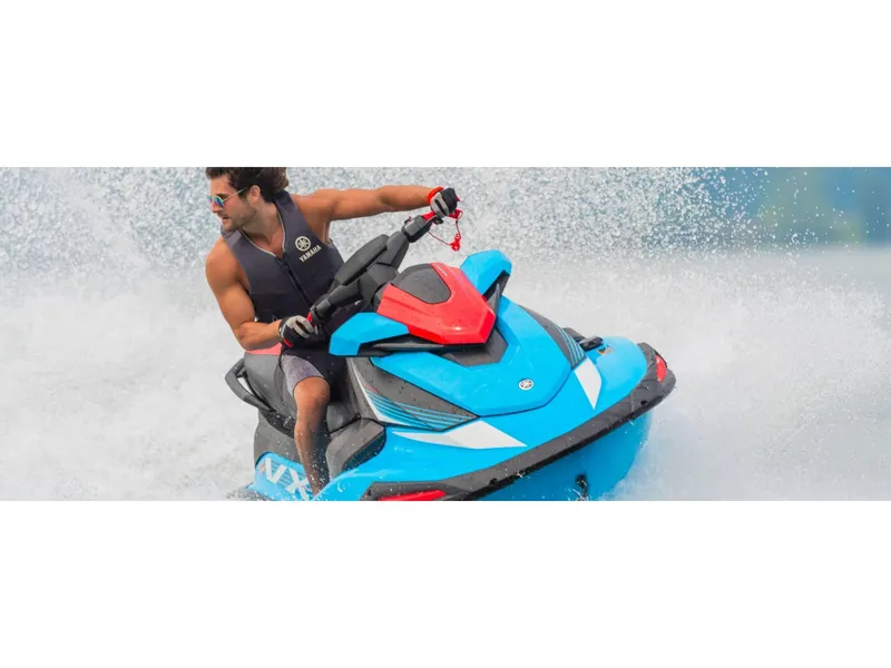 Slide: The Image of 2024 Yamaha VX Deluxe with Audio jet ski in action on water. - 9