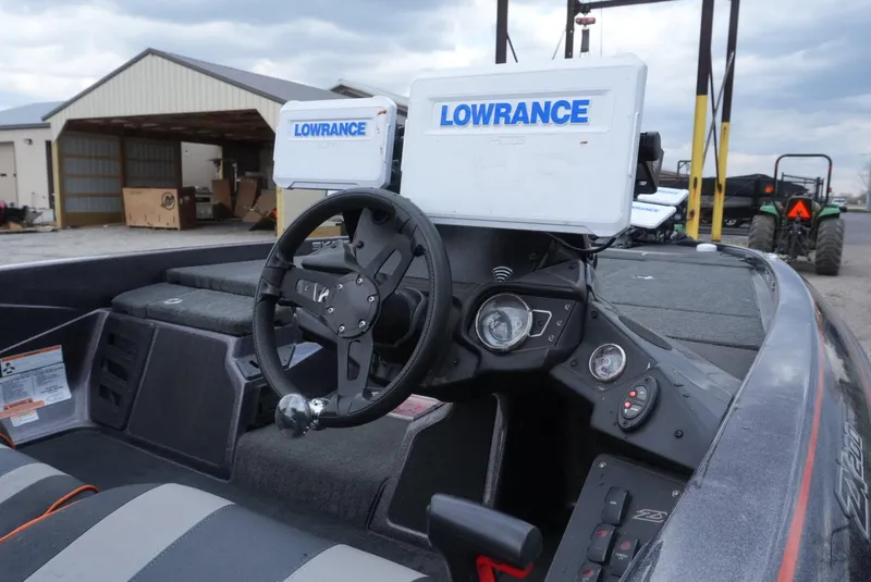 Slide: The Image of 2018 Skeeter ZX200 boat dashboard with Lowrance electronics and steering wheel. - 12