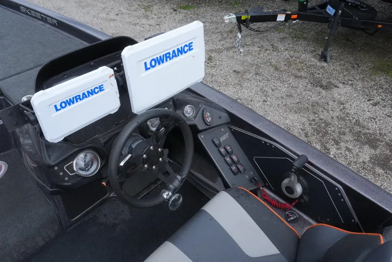 Slide: The Image of 2018 Skeeter ZX200 boat dashboard with Lowrance electronics and steering wheel. - 19