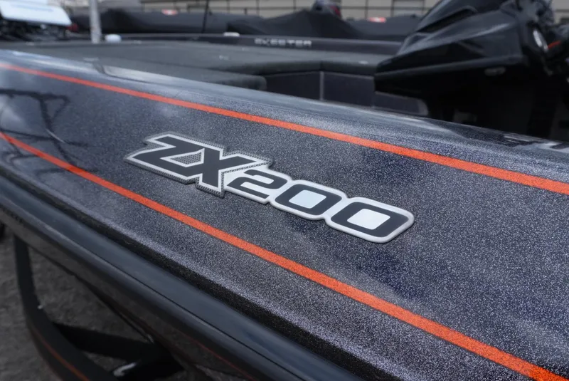 Slide: The Image of 2018 Skeeter ZX200 boat with sleek design and bold orange accents. - 5