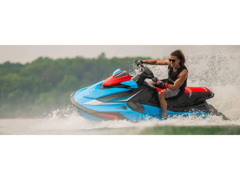 Slide: The Image of 2024 Yamaha VX Deluxe jet ski on water, rider enjoying high-speed adventure. - 9