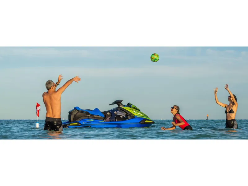 Slide: The Image of People playing in water near 2024 Yamaha Boats VX Limited HO jet ski. - 8