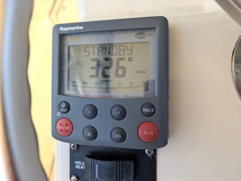 Slide: The Image of Raymarine autopilot display on 2001 Pursuit 3070 Offshore Center Console showing 326 degrees. - 17