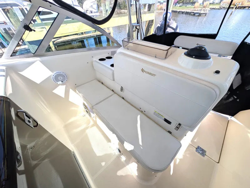 Slide: The Image of 2001 Pursuit 3070 Offshore Center Console interior with seating and helm station. - 18