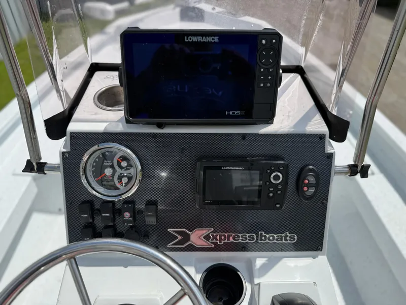 Slide: The Image of Control panel of 2022 Express H20 boat with Lowrance HDS display. - 13
