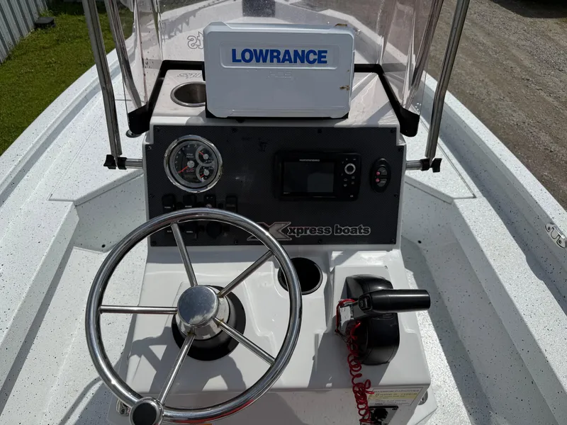 Slide: The Image of Steering console of 2022 Express H20 boat with Lowrance navigation system. - 14
