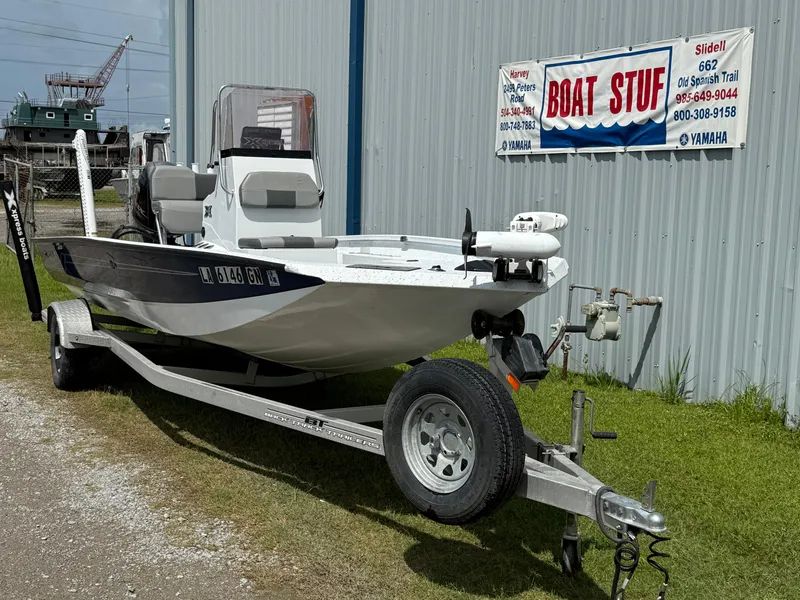 Slide: The Image of 2022 Express H20 boat on trailer outside Boat Stuff store. - 2