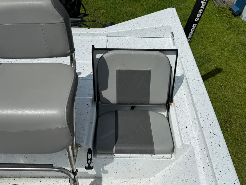 Slide: The Image of Gray seating on 2022 Express H20 boat, featuring foldable design and durable material. - 6