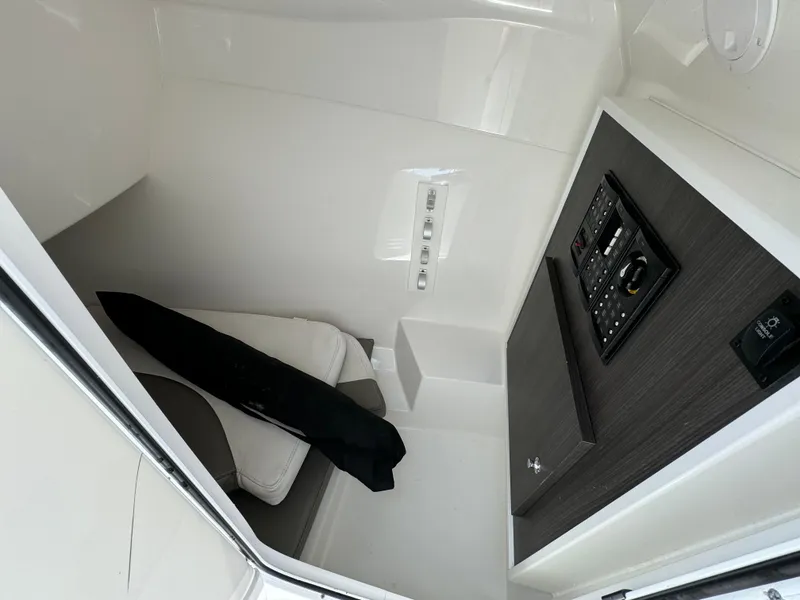 Slide: The Image of 2019 Albemarle 27 DC cabin interior with seating and control panel. - 13