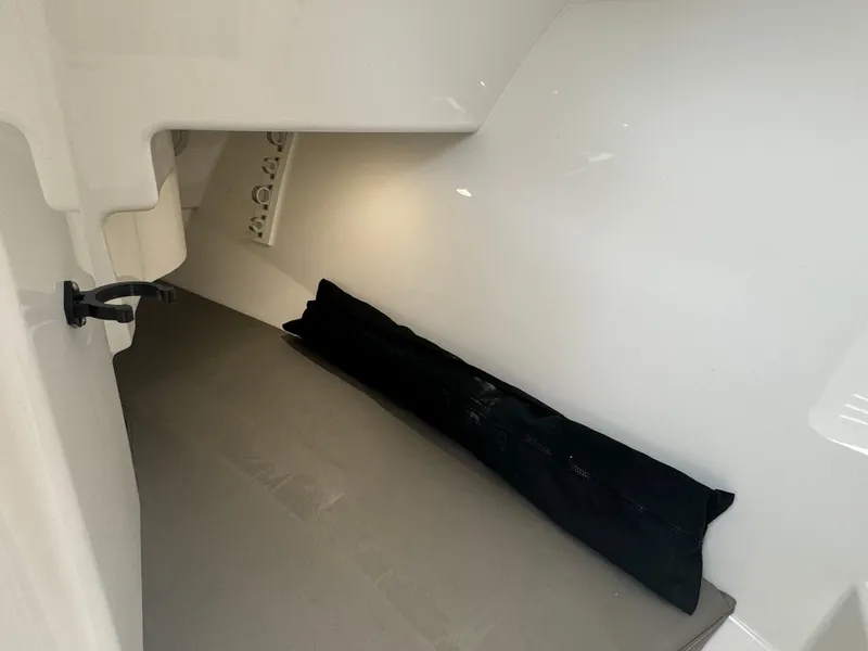 Slide: The Image of 2019 Albemarle 27 DC cabin interior with storage space and lighting. - 14