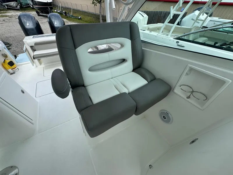 Slide: The Image of 2019 Albemarle 27 DC boat interior with gray and white seating. - 21