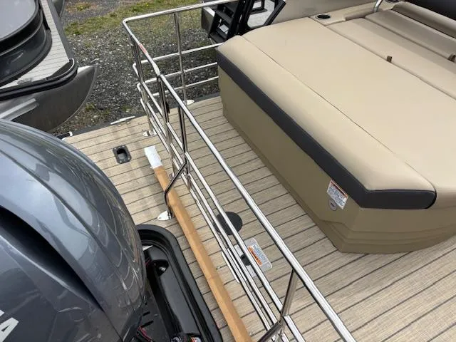 Slide: The Image of 2025 Sylvan X-3 CLZ boat deck with seating and railing, featuring a Yamaha engine. - 12