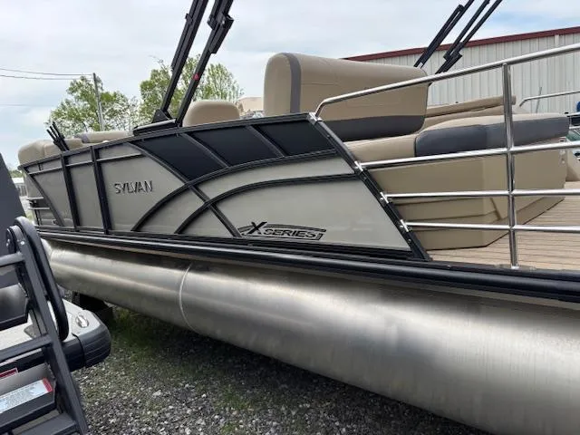 Slide: The Image of 2025 Sylvan X-3 CLZ pontoon boat with sleek design and comfortable seating. - 25