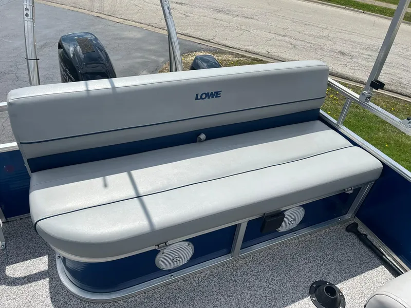 Slide: The Image of 2019 Lowe Ultra 182 Fish & Cruise boat with cushioned seating and storage compartments. - 10