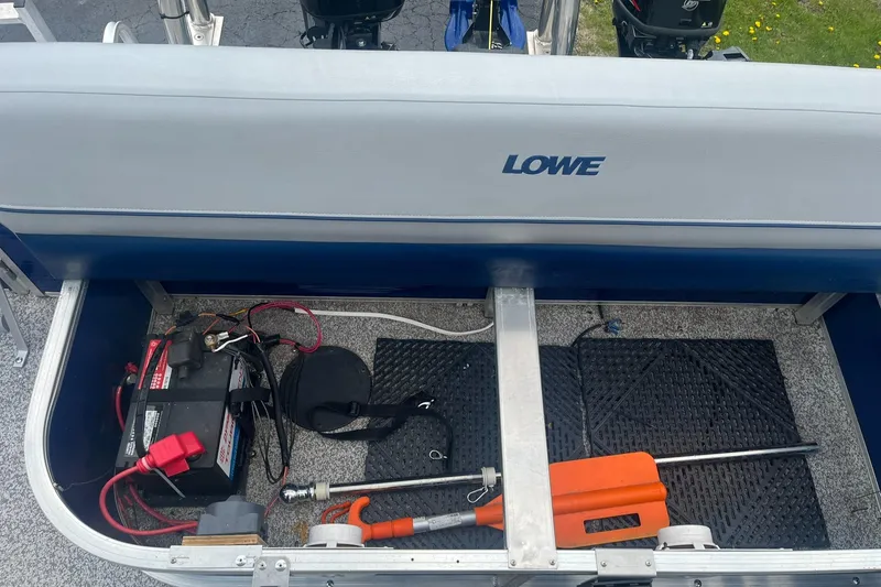 Slide: The Image of 2019 Lowe Ultra 182 Fish & Cruise boat storage with battery and equipment. - 11