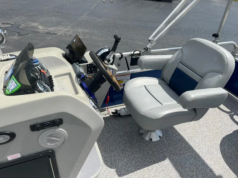 Slide: The Image of 2019 Lowe Ultra 182 Fish & Cruise boat interior with captain's chair and control panel. - 13