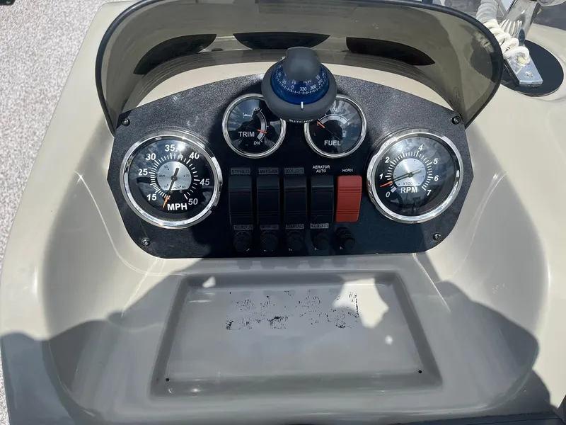 Slide: The Image of Control panel of 2019 Lowe Ultra 182 Fish & Cruise boat with gauges and switches. - 14