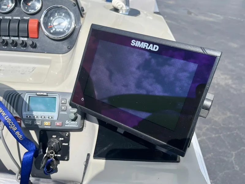 Slide: The Image of Control panel of a 2019 Lowe Ultra 182 Fish & Cruise boat with Simrad display. - 16