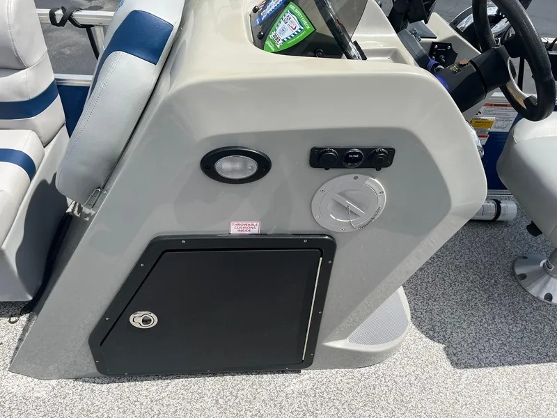 Slide: The Image of 2019 Lowe Ultra 182 Fish & Cruise boat console with steering wheel and controls. - 17