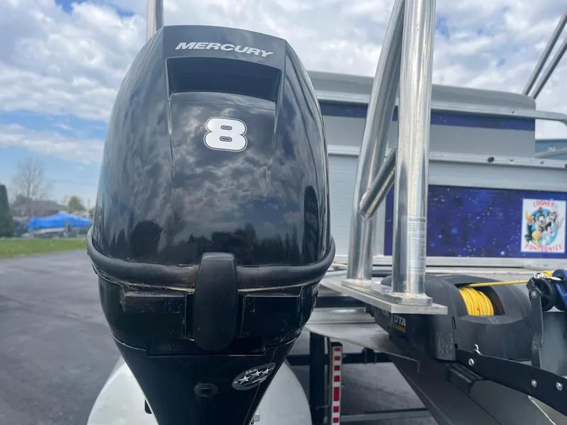 Slide: The Image of Mercury outboard motor on 2019 Lowe Ultra 182 Fish & Cruise boat, parked outdoors. - 26